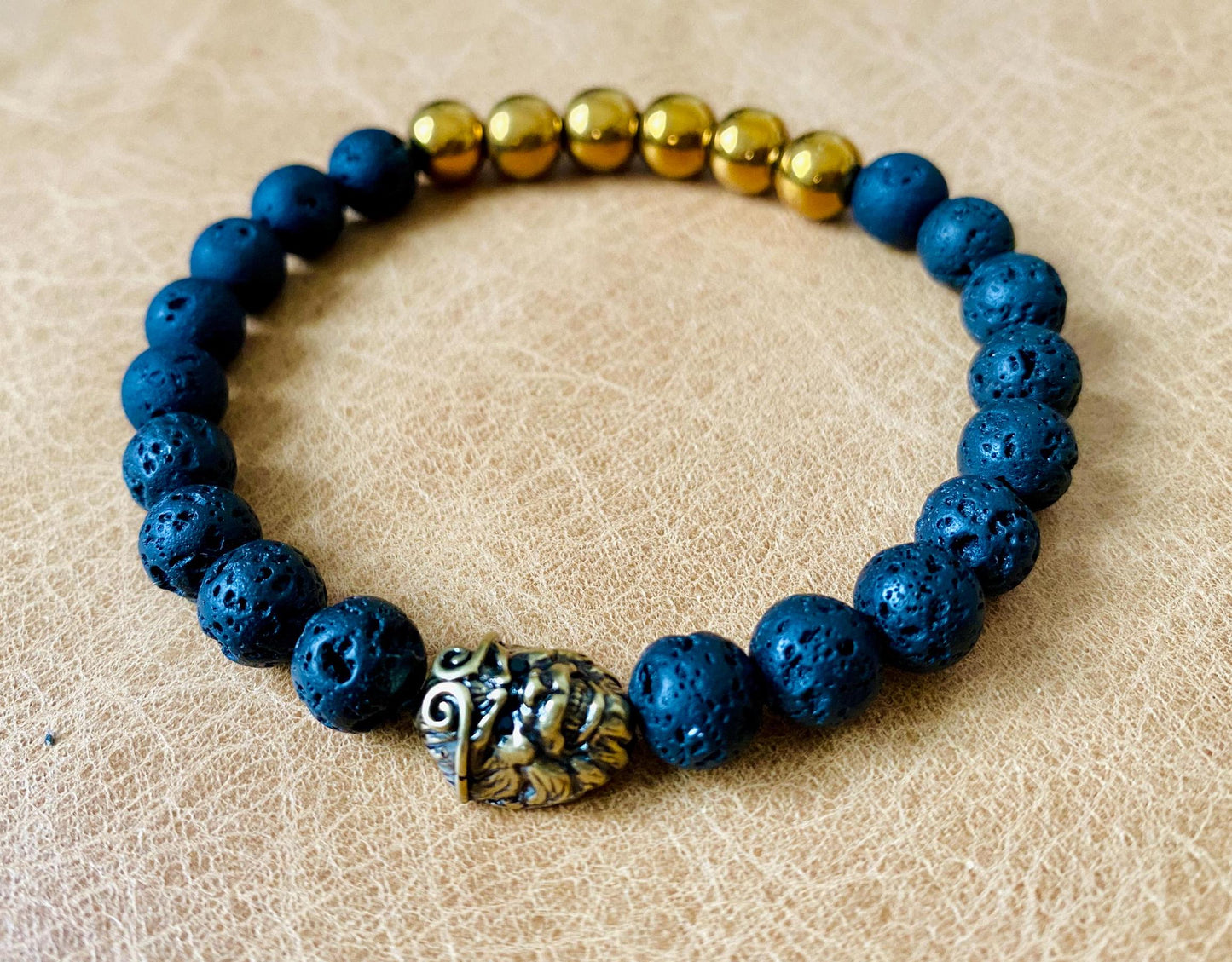 Pair of black and gold stretch bracelet