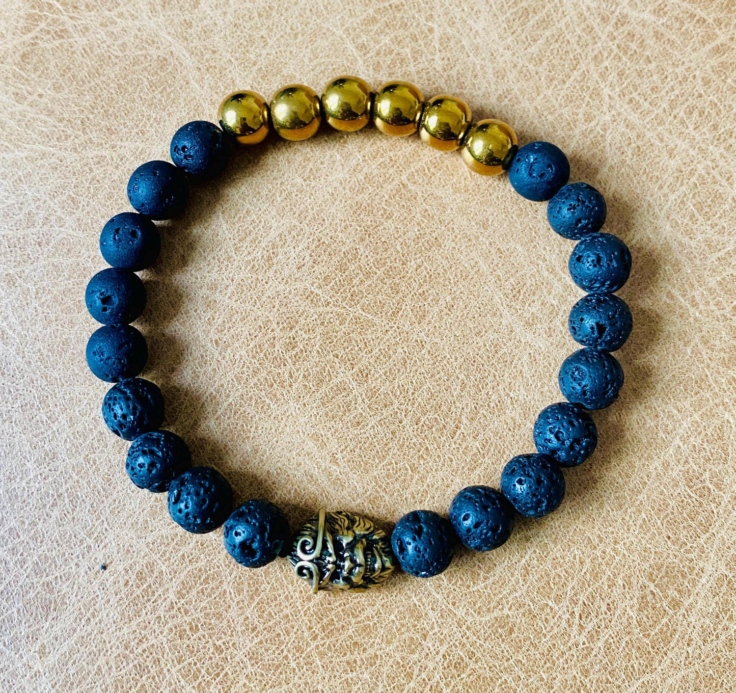 Pair of black and gold stretch bracelet