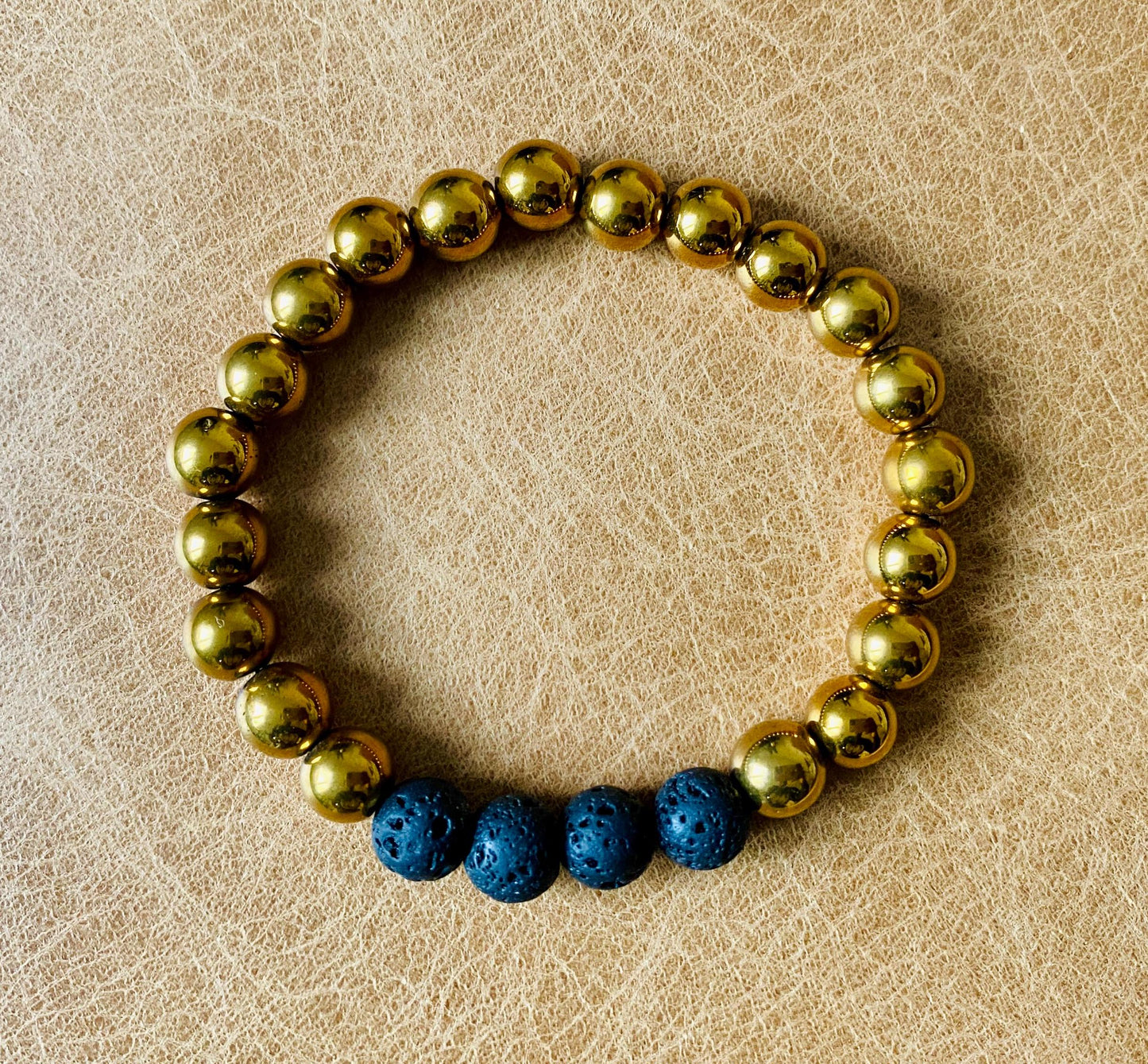 Pair of black and gold stretch bracelet