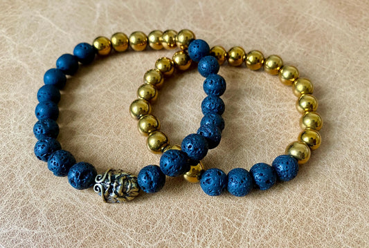Pair of black and gold stretch bracelet